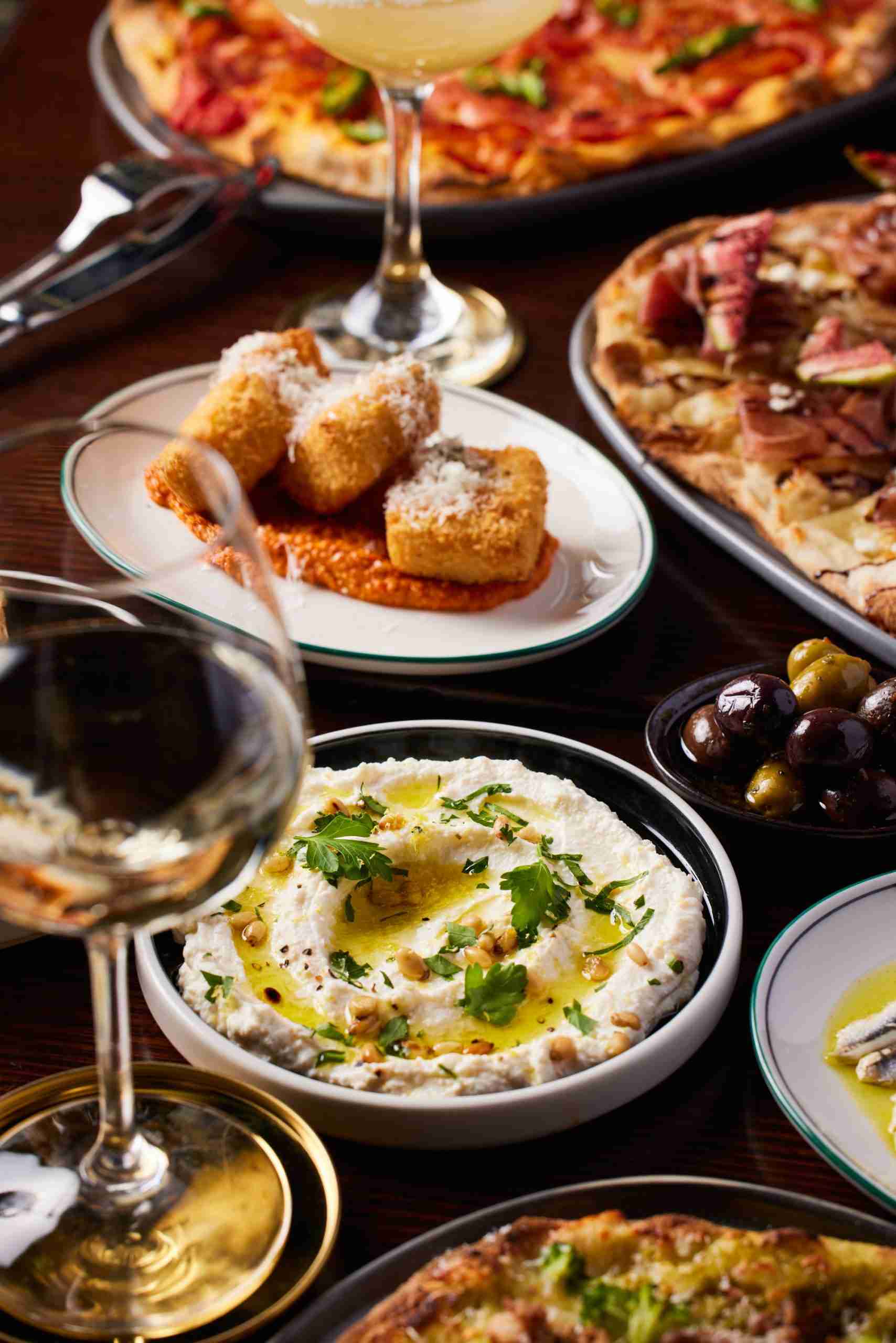 Whipped buffalo ricotta dip with nonna’s lasagna fritta and glass of wine
