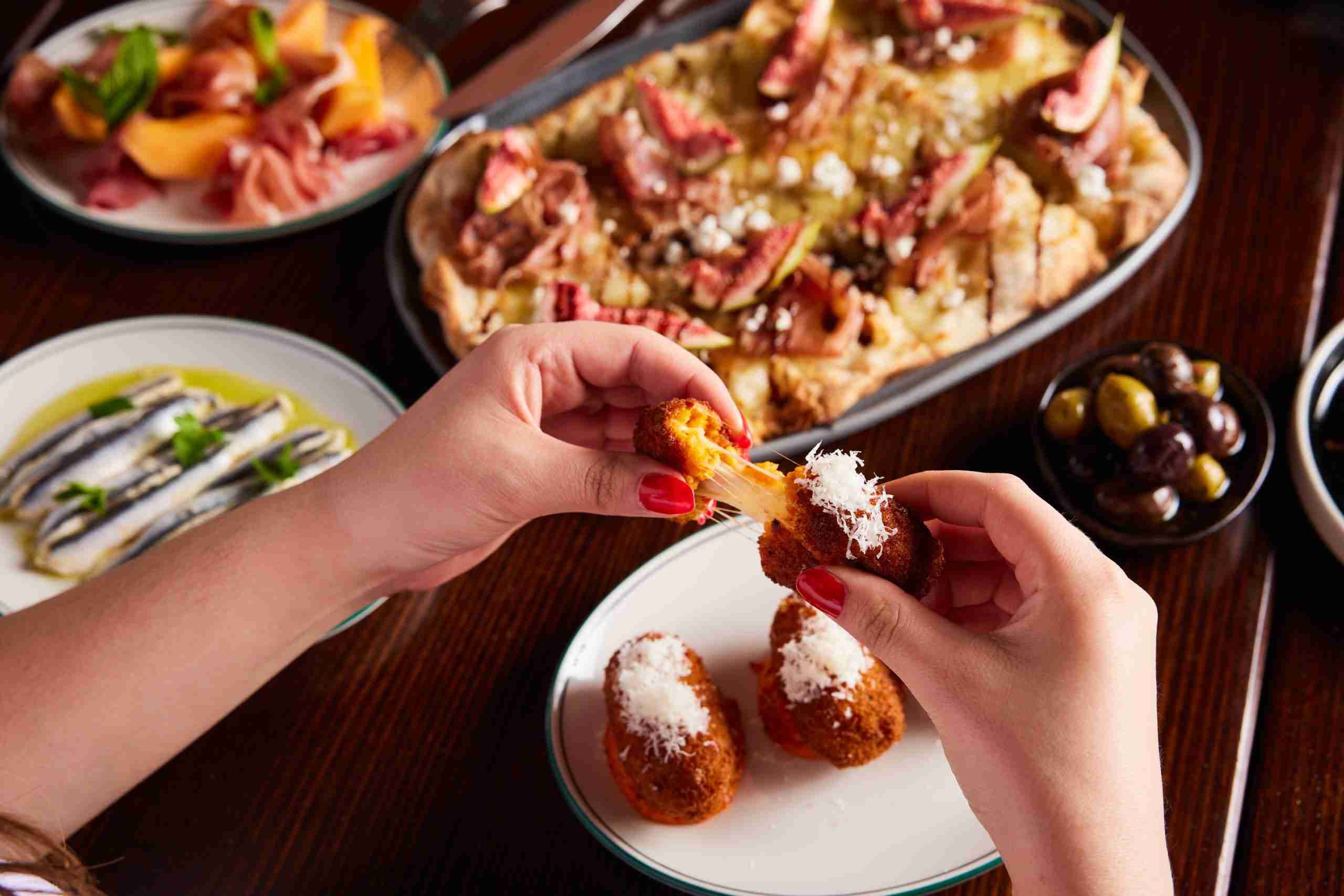 Arancini dish with cheese pull