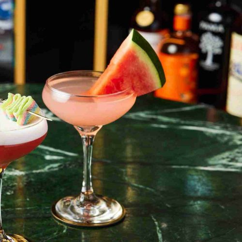 Delicious Cocktails on a green background